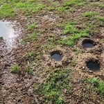 test holes drilled 4 days after a light rain on the low side of the house. These were dug 18 inches deep.