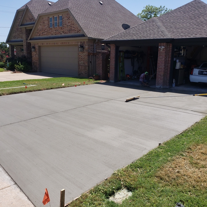 Poured and finished with light broom finish