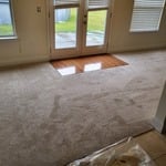 Carpet install with a hardwood foyer