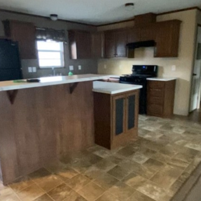 Cleaned all of the cabinets counter floors walls sparkling kitchen