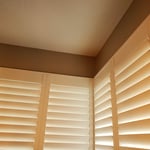 This particular frame is called L-Frame, it is boxier than the others.
The customer requested clear view (or hidden bar) which moves the traditional bar that you use to control the louvers (slats).