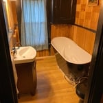 Sub floor leveled and replaced, holes repaired, vinyl flooring and baseboard molding added, new appliances hooked up to a more affective style of plumbing.