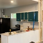 Homeowners wanted to provide seperation between the kitchen area and living room area while still keeping the "open layout" feel of the house. The remedy I provided was an open pass-through wall that could double as an extra area for guests to sit down and eat.