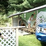 extended roof to cover wood storage.
