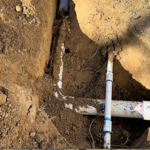 picture of installed drain line and water line for pool