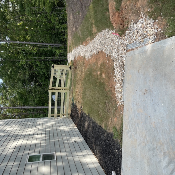 Fence/drains/mulch/rock
