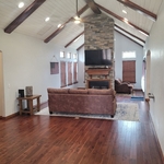 Side beams built and stained painting of the room ship lap on ceiling installation of wood floor