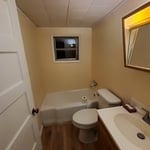 After Photo - New laminate flooring, fresh paint, and trim.