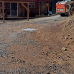 Traffic rated tank with lid to grade and the driveway looking better than when we started.