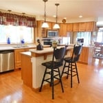 Lake House: Open concept kitchen/dining, lake view, soft pine "hardwood" floor with decorative "plugs" to cover floor fastening system. No white paint....all ceilings, trim, baseboards and walls have a color.