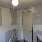 Staircase was too small to fit full sheets of drywall. Had to cut down to as big as would fit