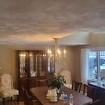 Beautiful Lennox chandelier hung at the edge of the dormer to center on the table..... Looks great!!!