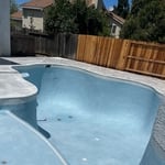 Natural stone paver overlay over existing concrete deck