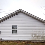 Before house was pressure sprayed by the Power Pros-notice the unsightly mold, mildew, dirt, grime and moss.