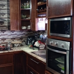After- adding in the oven, microwave, and backsplash.