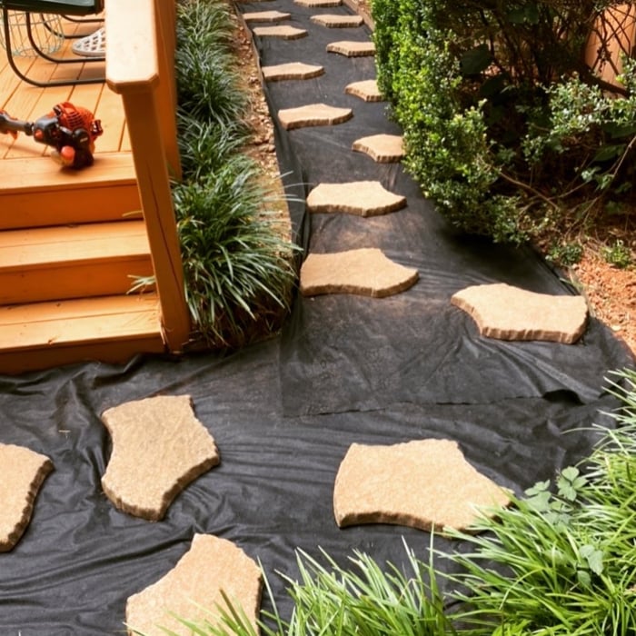 Refurbished back yard lawn and hardscaping service