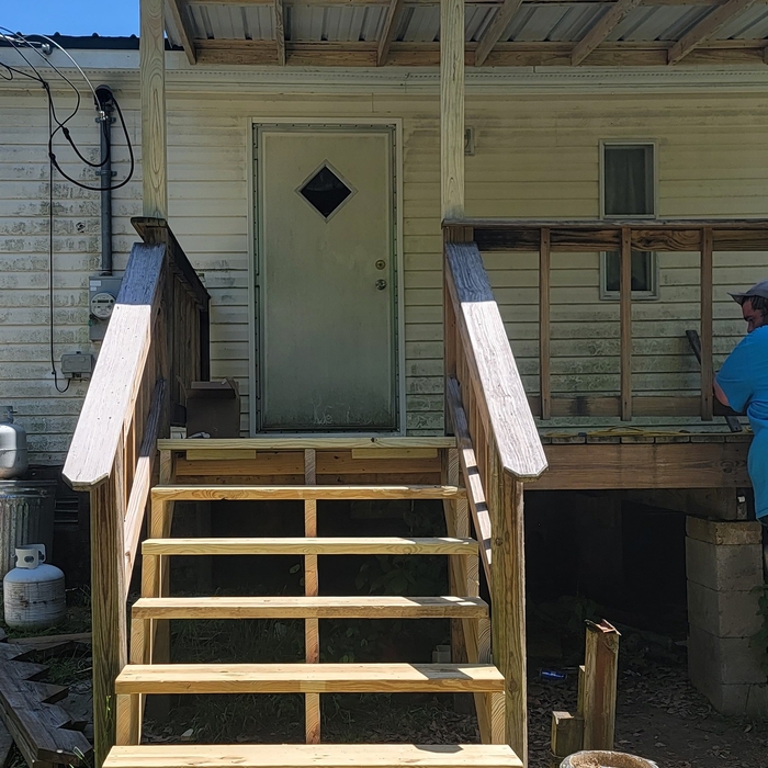 New steps were built with an extra runner in the center for more support.