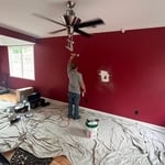 Repaired hole in wall and matched color repainted wall Cranberry