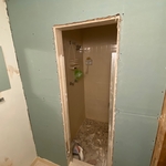 After taking all the old damaged drywall and cleaning the walls (taking all old screws and nails and anything that was on the way to perfectly install new drywall (Sheetrock)