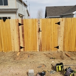 Backside of fence leading into utility access gate.