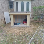 Framed up siding on and roof has been shingled