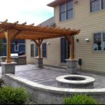 Patio, walls, fire pit, pergola and grill area