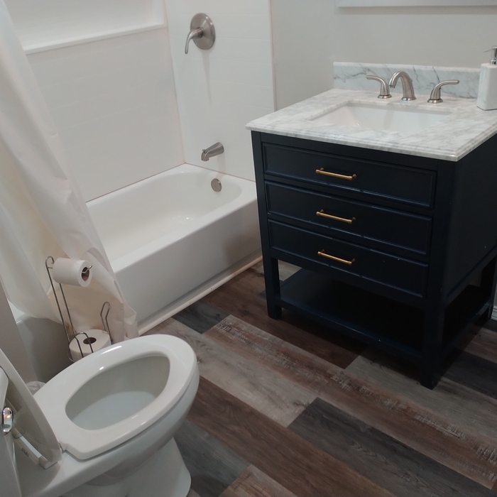 Stocked bathrooms and spot cleaned toilet