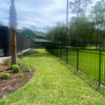 Back property fence line with 3 rail aluminum. One 5ft gate was included.