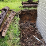 Railroad ties around shed