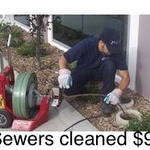 Electric sewer machine cable cleaning
