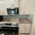 Perfectly placed tiles all around kitchen