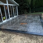 Wood plank stamped patio done in black and grey.