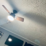 Tv and ceiling fan in the bedroom