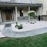 Landscaping with stone, plant additional shrubs
