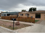 Front of her home with yard ending to be worked on.