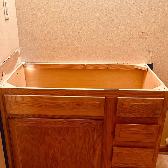 This is a stripped down bathroom countertop & mirror .