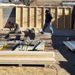 Fter laying and leveling all the pavers within the footings We stood up the walls and roof.