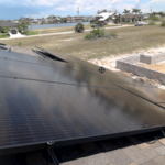 A slight gap between the roof surface and panel is the optimal design to allow air to pass beneath preventing the house from warming as a result of the panels.