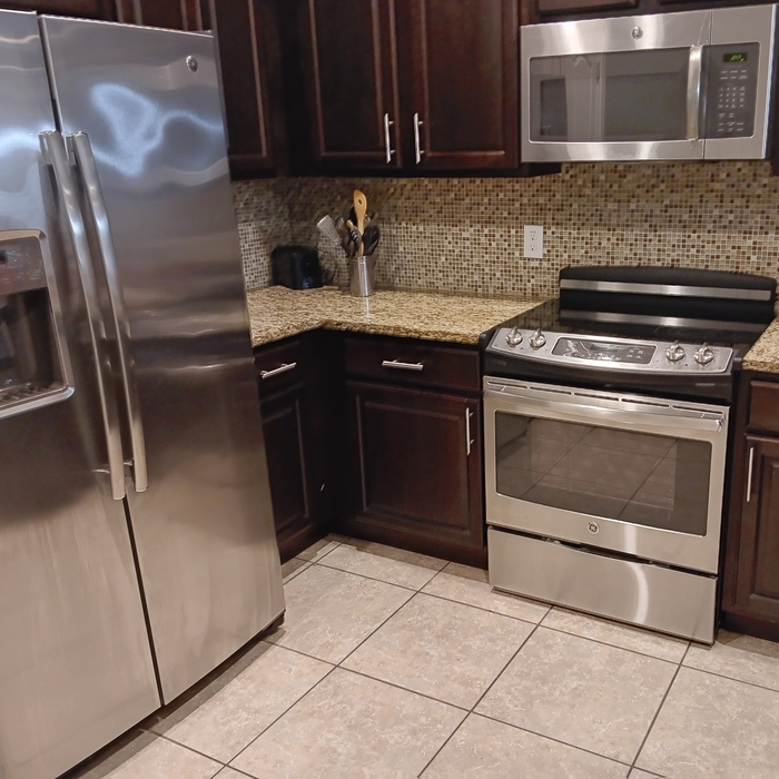 Polished The stainless steal refrigerator and stove and moped the floor.