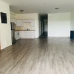 Large kitchen and living room space with new flooring and subfloor