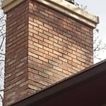 Chimney after being rebuilt with a new crown. Picture shows the framing at the top after we just poured the crown, which will be taken off at the final stage.