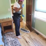 Dry mopping the wood flooring. Picking up dog’s hair on the way.