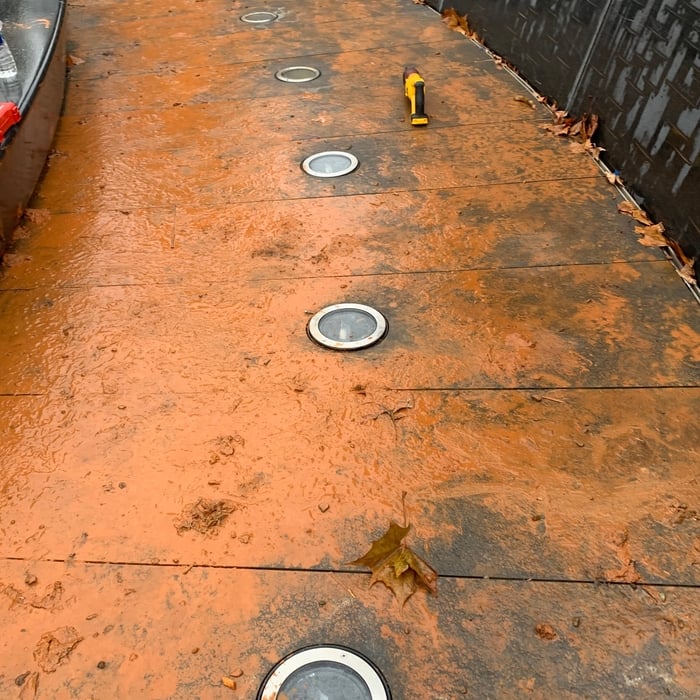 Nasty muddy day, but we got the Paver lights installed.