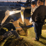 Working into the night back filling, to complete septic certification.