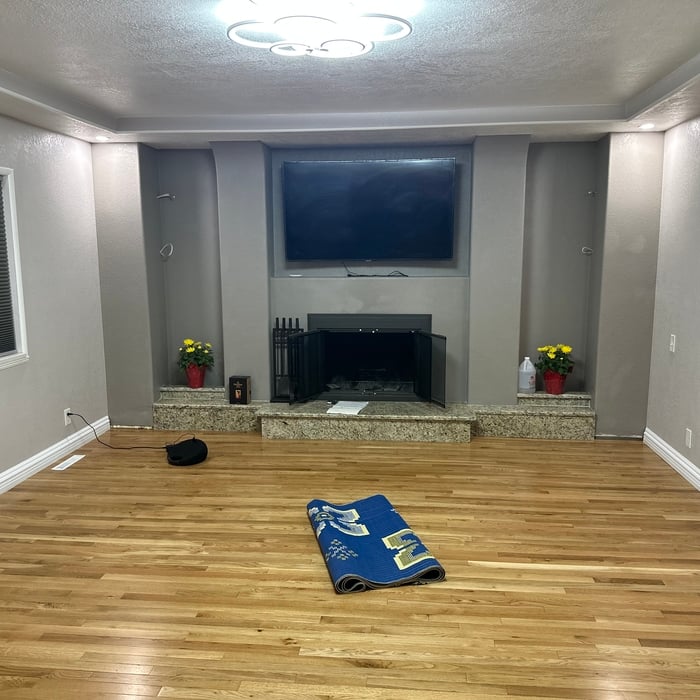 Living room remodel including hardwood flooring