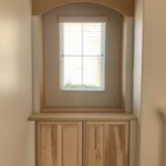 Left custom built-in shelving unit with two base cabinets