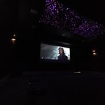 120" screen, 7.1.2 surround sound system, starlight ceiling, acoustic panels, Savant automation system.