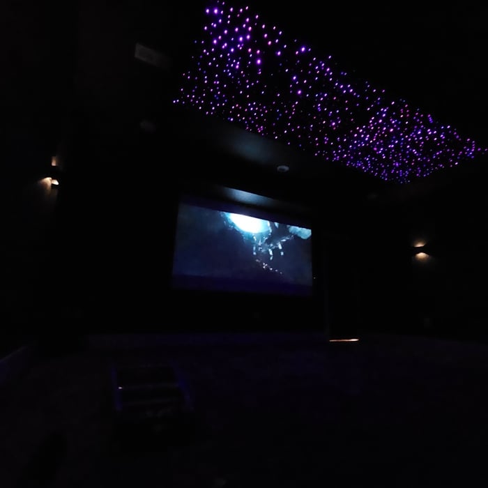 120" screen, 7.1.2 surround sound system, starlight ceiling, acoustic panels, Savant automation system.