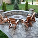 Stamped concrete patio w/ border, curved retaining wall-caped, and fire pit