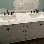 Moved and installed electrical outlets to accommodate the new sinks. Did not do the patch work.